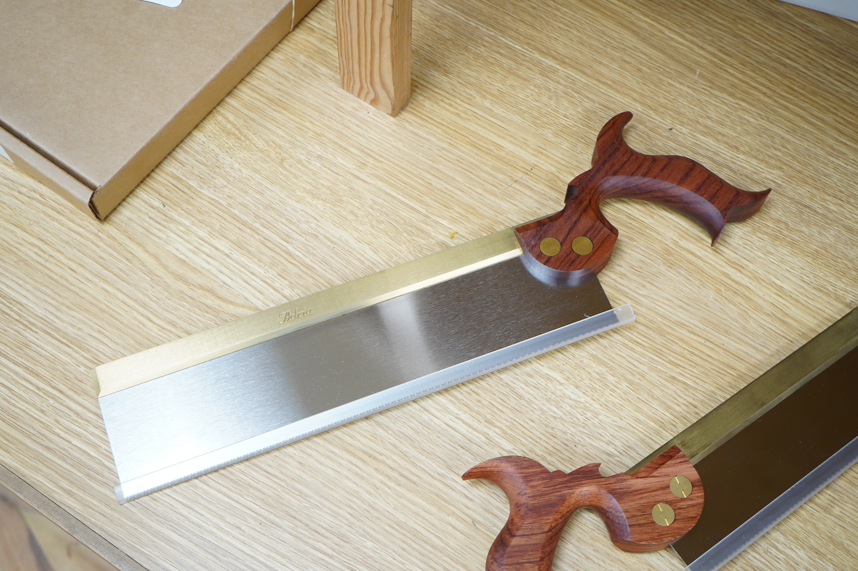 Two boxed Canadian Adria Toolworks Inc. wood saws; a small tenon rip saw, together with a dovetail saw